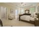 Spacious main bedroom with a tray ceiling, neutral carpet, and classic furniture at 1016 Pasture View Ln, Raleigh, NC 27603