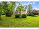 Manicured lawn and landscaping surround this beautiful home at 1016 Pasture View Ln, Raleigh, NC 27603