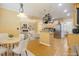 Open-concept kitchen and dining area with modern appliances and ample counter space, staged virtually at 1016 Pasture View Ln, Raleigh, NC 27603
