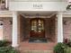 Brick building entrance with double doors, columns, and the building number at 10411 Rosegate Court # 6, Raleigh, NC 27617