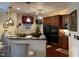 Charming kitchen with stylish pendant lighting, dark wood cabinets, and granite countertops at 10411 Rosegate Court # 6, Raleigh, NC 27617