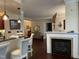 Open living space with bar seating, a fireplace, and elegant decor throughout at 10411 Rosegate Court # 6, Raleigh, NC 27617