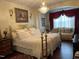 Luxurious main bedroom with chandelier, sitting area, and elegant decor at 10411 Rosegate Court # 6, Raleigh, NC 27617