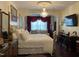 Luxurious main bedroom with chandelier, sitting area, and elegant decor at 10411 Rosegate Court # 6, Raleigh, NC 27617
