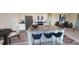 Modern kitchen with granite countertops, stainless steel appliances, and a breakfast bar for casual dining at 1204 Solace Way, Rolesville, NC 27571