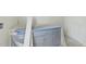 Gray vanity cabinet installation with protective covering; bathroom in progress at 1221 Dixie Trl, Raleigh, NC 27607