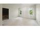 Bright bedroom featuring two windows and fresh paint ready for flooring at 1221 Dixie Trl, Raleigh, NC 27607