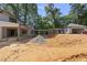 This home features a breezeway connecting the house to a two-car garage, all ready for landscaping at 1221 Dixie Trl, Raleigh, NC 27607