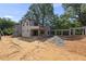 A beautiful home with a connected garage and an outdoor space ready for landscaping at 1221 Dixie Trl, Raleigh, NC 27607
