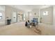 Spacious living room with sliding doors, fireplace, and lots of natural light at 1221 Dixie Trl, Raleigh, NC 27607