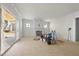 Spacious living room with sliding doors, fireplace, and lots of natural light at 1221 Dixie Trl, Raleigh, NC 27607
