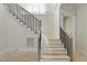 Elegant staircase with dark railing, ready for finishing touches and leading to the upper level at 1221 Dixie Trl, Raleigh, NC 27607