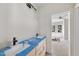 A modern bathroom features sleek fixtures, a large vanity, and a separate toilet area at 1225 Dixie Trl, Raleigh, NC 27607