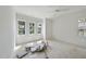 A spacious bedroom is filled with natural light from many windows and awaits custom flooring at 1225 Dixie Trl, Raleigh, NC 27607
