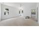 Spacious bedroom with three large windows and an en suite bathroom at 1225 Dixie Trl, Raleigh, NC 27607