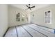 Bedroom with multiple windows allowing ample natural light and ceiling fan at 1225 Dixie Trl, Raleigh, NC 27607