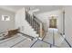 Foyer with staircase and view of front door at 1225 Dixie Trl, Raleigh, NC 27607