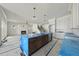 Open-concept living room with a fireplace, access to the backyard, and a staircase at 1225 Dixie Trl, Raleigh, NC 27607