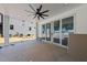 Covered patio includes ceiling fan and stone flooring, offering space for outdoor entertaining at 1225 Dixie Trl, Raleigh, NC 27607