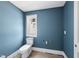 Powder room with blue walls at 1225 Dixie Trl, Raleigh, NC 27607