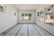 Sunroom with natural light and windows overlooking the backyard at 1225 Dixie Trl, Raleigh, NC 27607