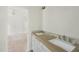Bathroom featuring double vanity with white cabinets, grey and white countertop, and modern fixtures at 1229 Dixie Trl, Raleigh, NC 27607