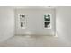 Bedroom with natural light streaming through the windows, with neutral walls and trim at 1229 Dixie Trl, Raleigh, NC 27607