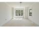 Bright bedroom featuring white walls, trim, and a ceiling fan plus a large window offering lots of natural light at 1229 Dixie Trl, Raleigh, NC 27607