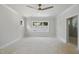 Light bedroom with white walls, white trim, and a wood ceiling fan for a modern look at 1229 Dixie Trl, Raleigh, NC 27607