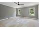 Bedroom with contrasting dark gray walls and white trim, brightened by natural light through windows at 1229 Dixie Trl, Raleigh, NC 27607