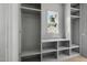 Closet featuring gray paint, built-in shelving, and a window for natural light at 1229 Dixie Trl, Raleigh, NC 27607