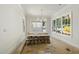 The dining room features a chandelier and a large window with view at 1229 Dixie Trl, Raleigh, NC 27607