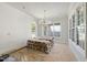 The dining room shows white walls, a chandelier, and large windows at 1229 Dixie Trl, Raleigh, NC 27607