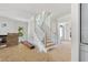 Elegant staircase featuring classic white railings and bright windows at 1229 Dixie Trl, Raleigh, NC 27607