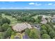An aerial of a golf community featuring a clubhouse, golf course, and beautiful homes at 12412 Mayhurst Pl, Raleigh, NC 27614