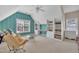 Spacious bonus room with comfortable seating and built in shelving at 12412 Mayhurst Pl, Raleigh, NC 27614