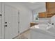 Clean laundry room with a white washer and dryer and natural light at 12412 Mayhurst Pl, Raleigh, NC 27614