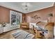 Music room with decorative trim, piano, organ, and large window for natural light at 12412 Mayhurst Pl, Raleigh, NC 27614