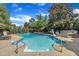 Sparkling pool with a hot tub and lush landscaping at 12412 Mayhurst Pl, Raleigh, NC 27614