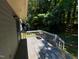 Back deck featuring grill, railings, and wooden flooring at 1306 Oakridge Ave, Henderson, NC 27536
