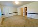 A spacious bedroom features neutral walls, carpet floors, and trim details at 1306 Oakridge Ave, Henderson, NC 27536
