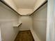 Walk-in closet offering great storage space with shelving and carpeted floor at 1306 Oakridge Ave, Henderson, NC 27536