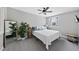 Bedroom with a large window, a ceiling fan, and an accent plant at 1500 River Mill Dr # 310, Wake Forest, NC 27587