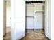 Bright closet with wooden floors, built-in shelving, and open doors at 1500 River Mill Dr # 310, Wake Forest, NC 27587
