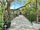 Exterior view of a building with a stone facade and a walkway at 1500 River Mill Dr # 310, Wake Forest, NC 27587