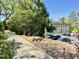 Exterior view of a building with stone facade, parking and lush greenery at 1500 River Mill Dr # 310, Wake Forest, NC 27587