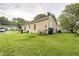Back view of house showing siding, satellite, and backyard at 1726 Morgantown Rd, Burlington, NC 27217