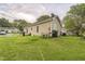 Back view of house showing siding, satellite, and backyard at 1726 Morgantown Rd, Burlington, NC 27217