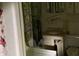 Small bathroom with a vanity, toilet, and washing machine at 1806 Rendall St, Burlington, NC 27215