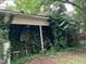 Exterior showing foliage coverage of the side of the house at 1806 Rendall St, Burlington, NC 27215
